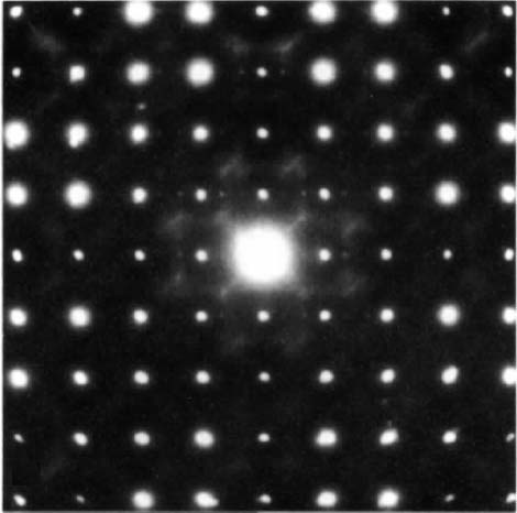 The electron diffraction patterns (along [001]) of two crystallites of Nb4W13O49